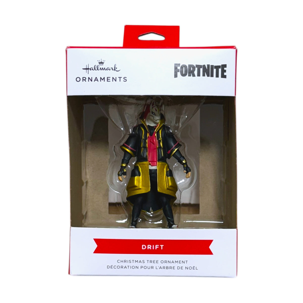 Hallmark Fortnite Drift Christmas tree ornament wearing a fox mask and black and gold outfit in its window display box