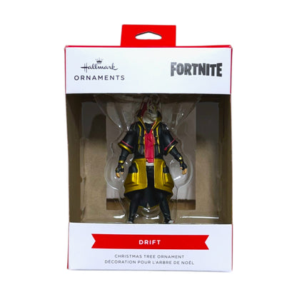 Hallmark Fortnite Drift Christmas tree ornament wearing a fox mask and black and gold outfit in its window display box