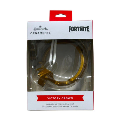 Hallmark Fortnite Victory Crown Christmas tree ornament with a gold-tone crown design and hanging ribbon in its window display box.
