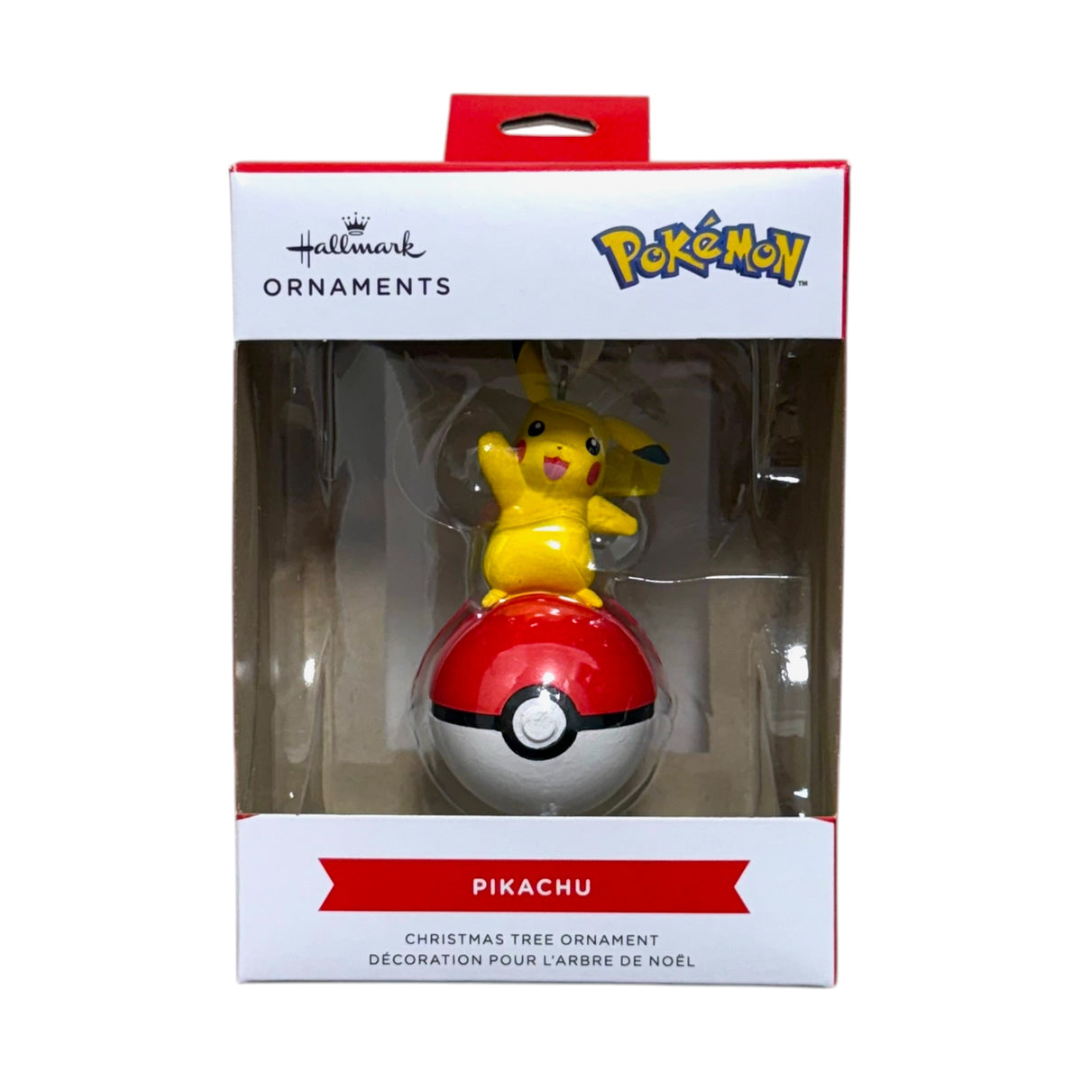 Hallmark Pokémon Pikachu Christmas tree ornament with Pikachu waving from a red and white Poké Ball in its display box