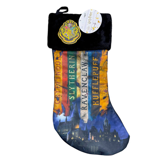 Harry Potter Christmas stocking with Gryffindor, Slytherin, Ravenclaw and Hufflepuff banners, Hogwarts castle and a crest on the black plush cuff