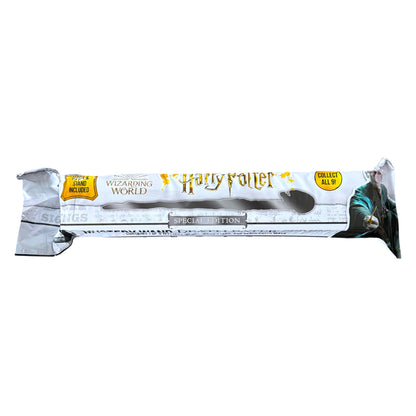 A Harry Potter Wizarding World collectible wand in its original silver foil packaging, featuring the yellow 'Harry Potter' logo and character artwork of Voldermort on the right side.