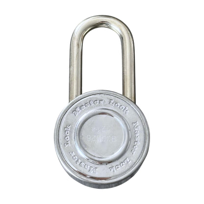 A silver metal padlock with a round body and U-shaped shackle, shown against a plain white background. The front of the lock features a circular plate with embossed text 'Master Lock'.