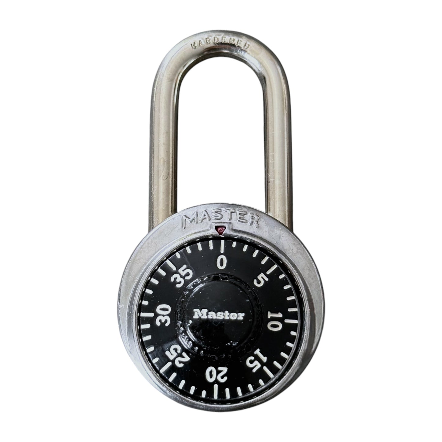 A Master brand combination lock with a silver metal shackle and body, featuring a black dial face with white numbers and markings.