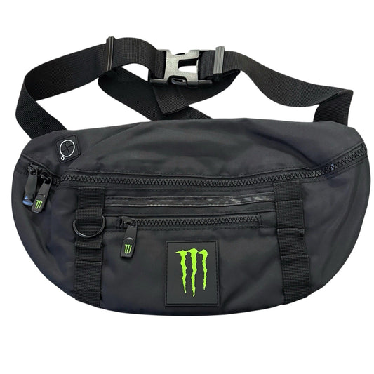 A black Monster Energy crossbody fanny pack with a bright green claw logo patch on the front, shown against a plain white background.