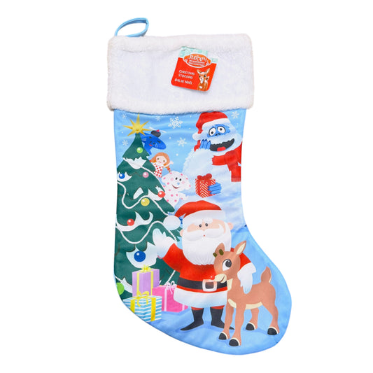 Rudolph the Red-Nosed Reindeer Christmas stocking featuring Rudolph, Santa and Bumble beside a Christmas tree with a white plush cuff