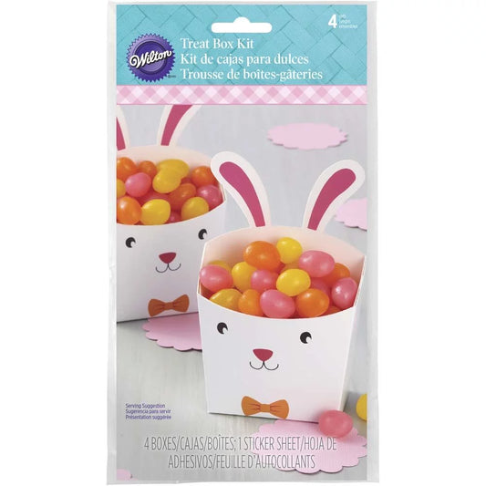 Wilton Easter Bunny Treat Box Kit packaging showing white rabbit boxes filled with jelly beans, with printed faces and orange bow ties.